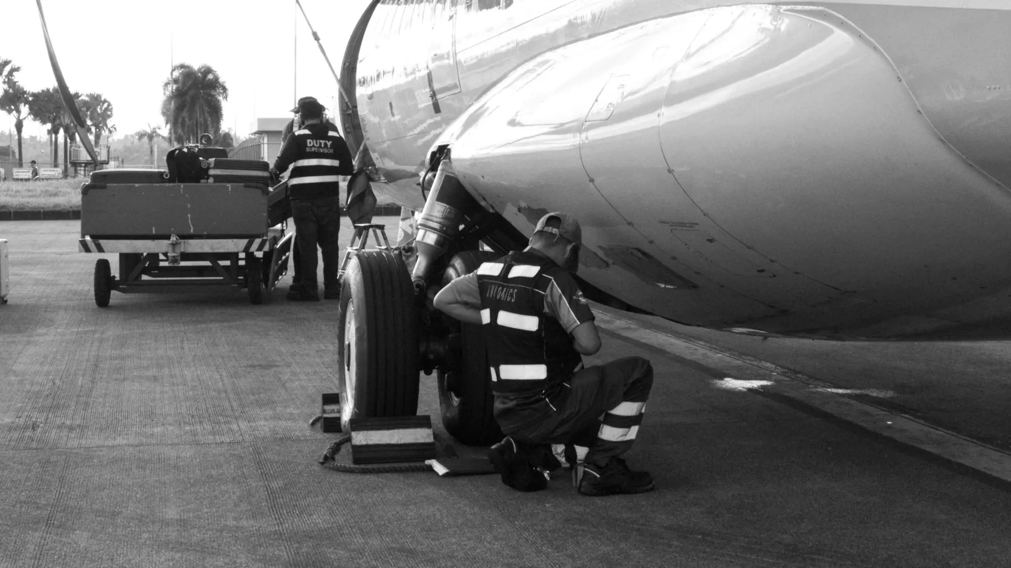 Maintenance crew working on an aircraft wheel